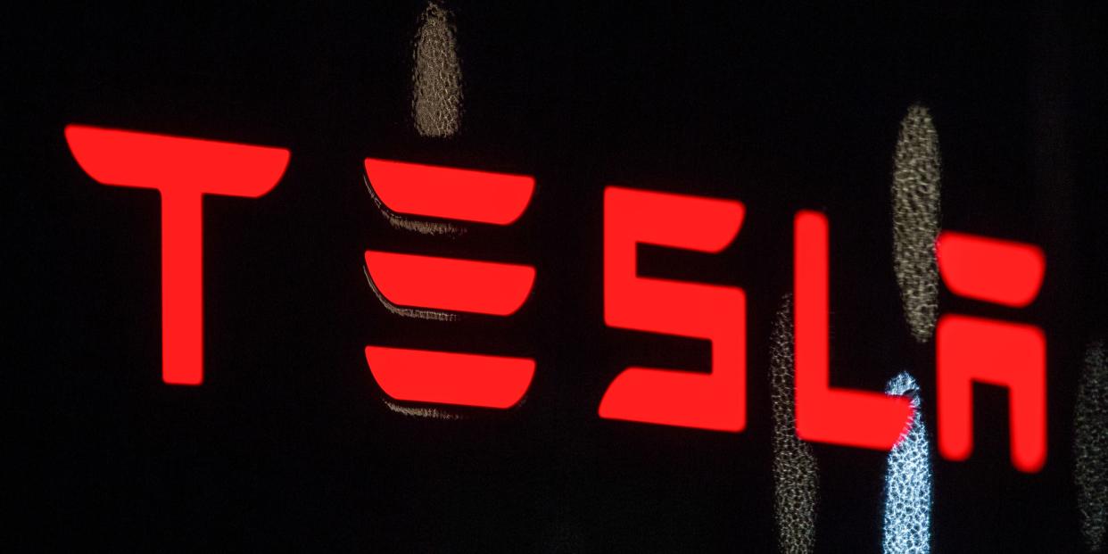 Tesla logo in red