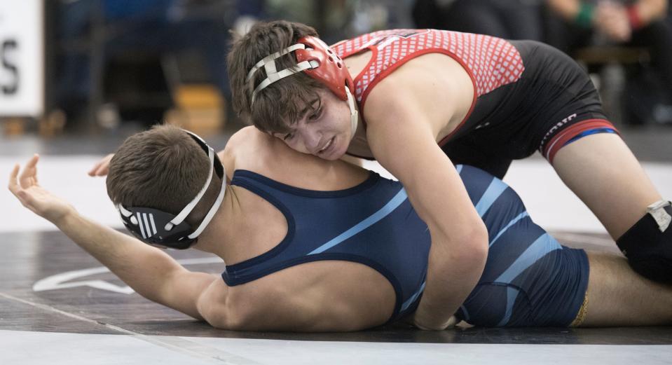 Kingsway's Nathan Taylor, top, controls St. Augustine's D'Amani Almodovar during the 126-pound final of the Region 8 wrestling championships at Egg Harbor Township High School, Saturday, Feb. 26, 2022. Taylor defeated Almodovar, 3-2.