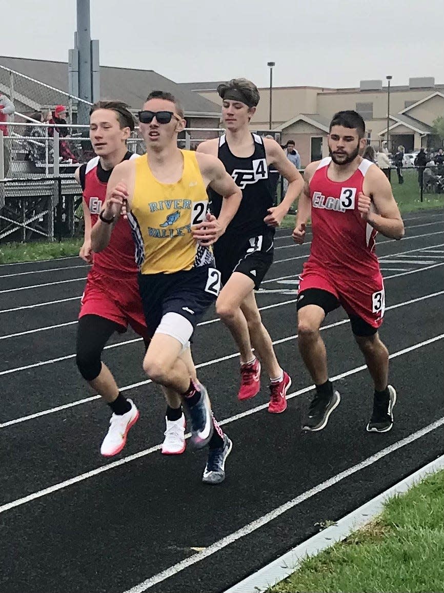 From left, Elgin's Ethan Marshall, River Valley's Joe Montgomery, Pleasant's Zeke McNulty and Elgin's Sage Brewer compete in a hotly contested 1600-meter boys run at the Marion County Track Meet last week at River Valley. McNulty won the event.