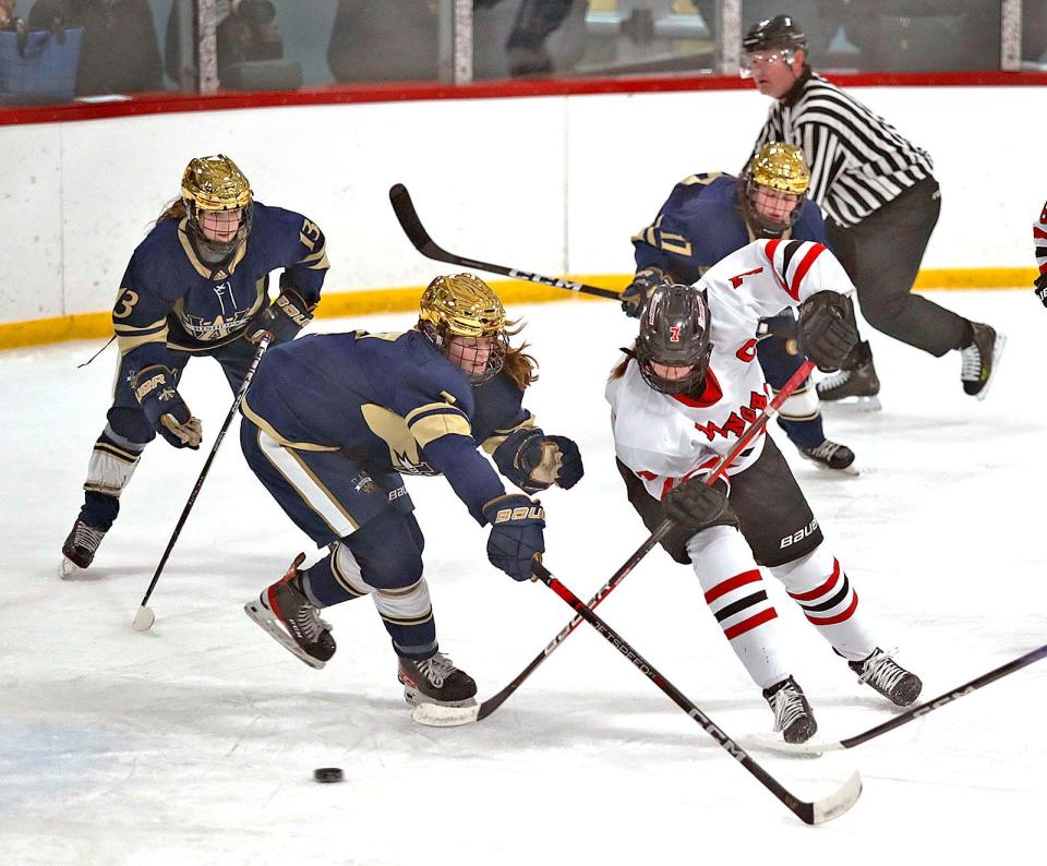 Hingham forward, captain Caroline Doherty tries to get past a pair of Bishops.
Hingham girls hockey hosted Archbishop Williams at Pilgrim Arena on Wednesday Jan. 10, 2024