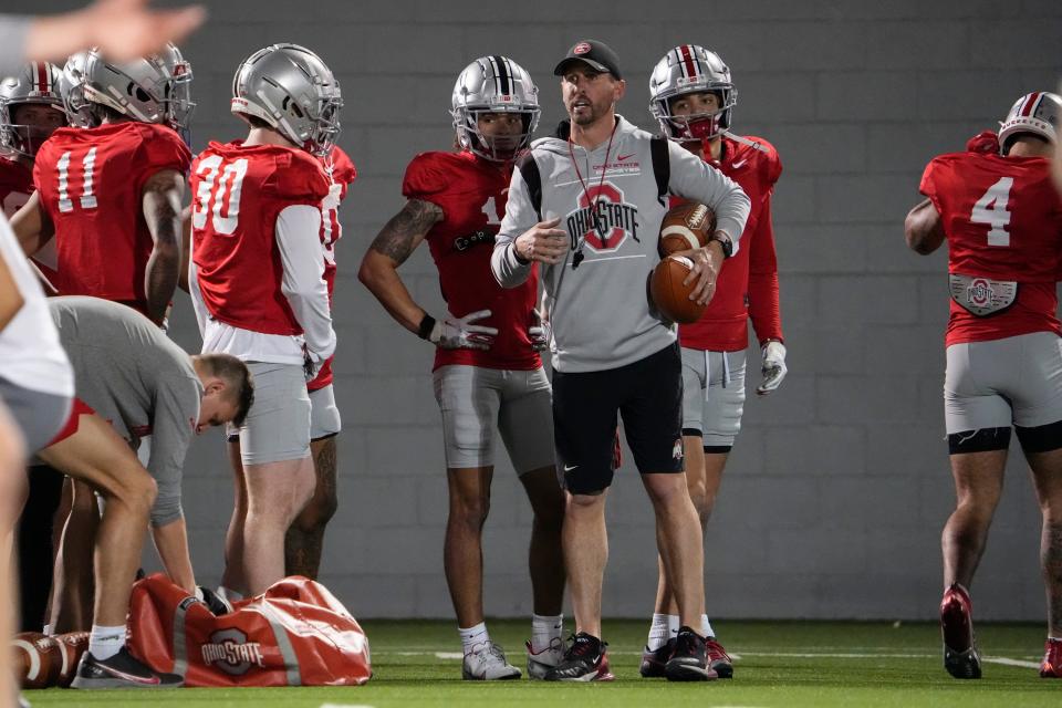 Ohio State's Brian Hartline was named the Buckeyes passing game coordinator this January and will make $950,000 as a result.
