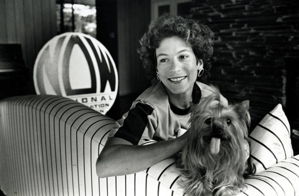 Kim Thomas is seen with her Yorkshire terrier Rags in her home in Charlotte in this file photo from Aug. 22, 1989. The activist/mother was handcuffed and slashed to death in her home less than a year later. The crime remains unsolved.