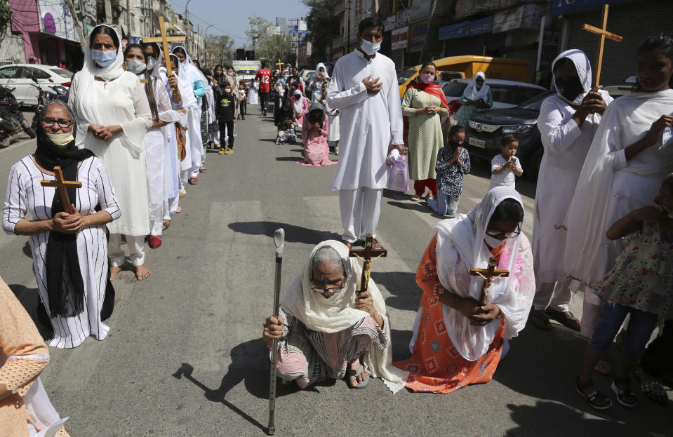 Christians participate in a procession to mark Good Friday in Jammu, India, Friday, April 2, 2021. Christians all over the world attend mock crucifixions and passion plays that mark the day Jesus was crucified, known to Christians as Good Friday. (AP Photo/Channi Anand)