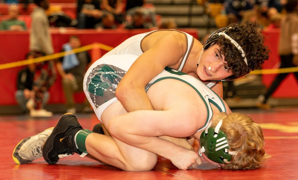 Watchung Hills Regional’s Anthony DiAndrea (red) beats Ridge’s Tanner Connelly (green) in the 106 weight class at the 2023 Somerset County Boys Wrestling Tournament on Jan. 7 at the gymnasium at Hillsborough High School in Hillsborough.