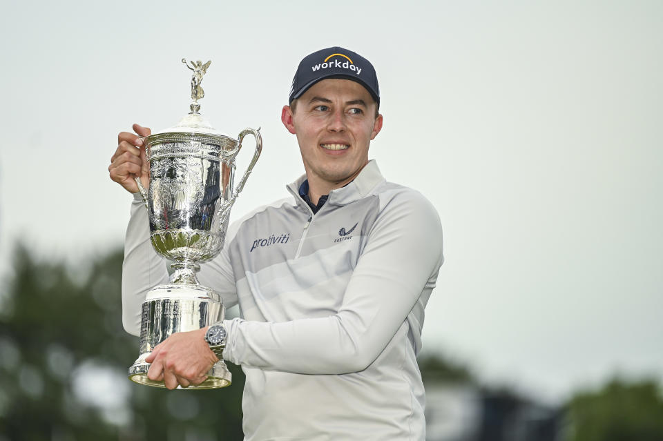 Pictured here, Matt Fitzpatrick smiles with the trophy after his one-stroke win to claim the US Open title. 