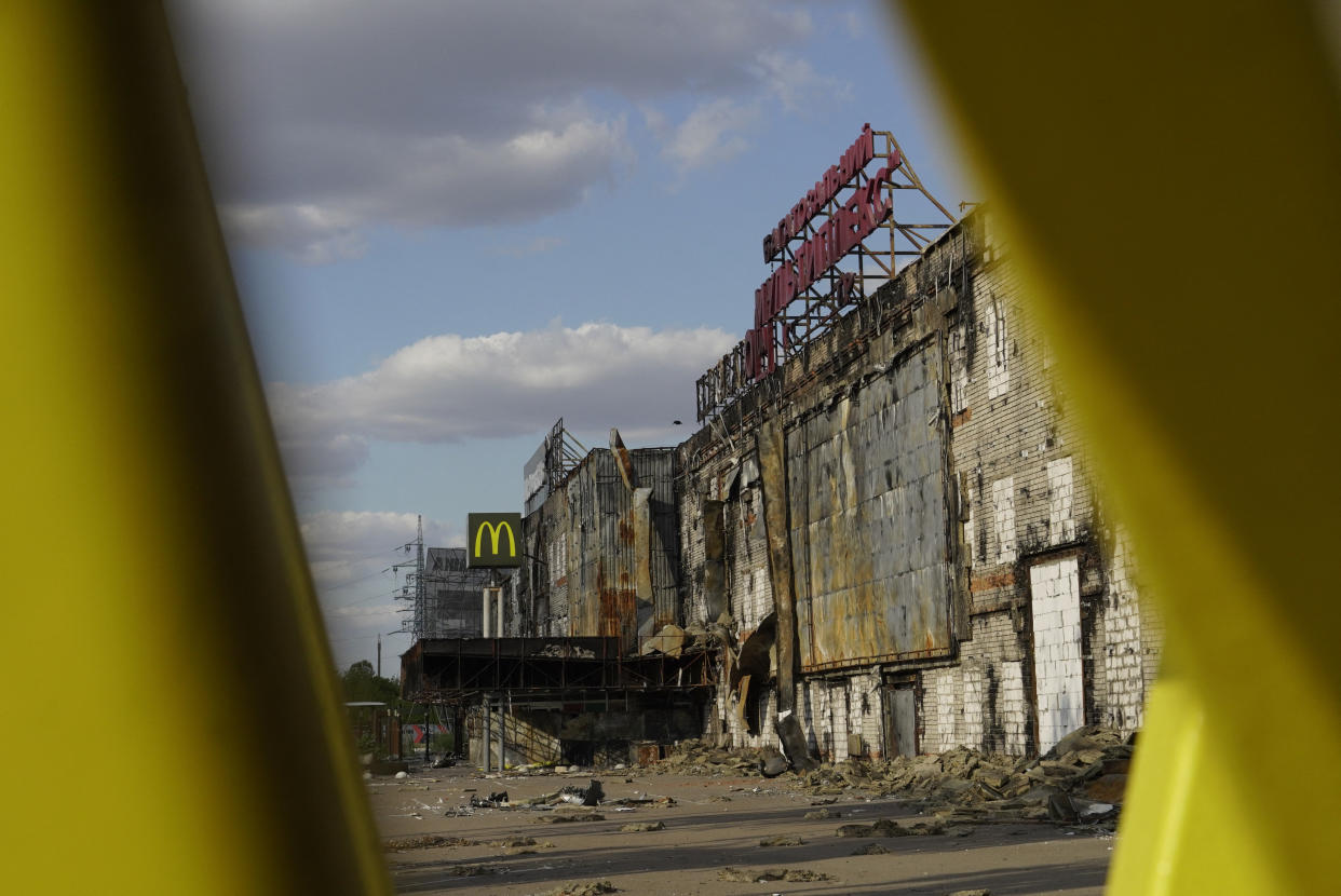 A view of the destroyed Fabrika shopping mall with burned-out and bricked-up facades.