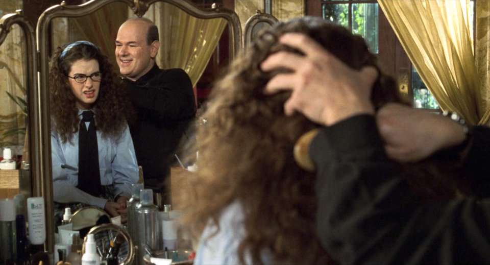 Paolo brushing Mia's hair