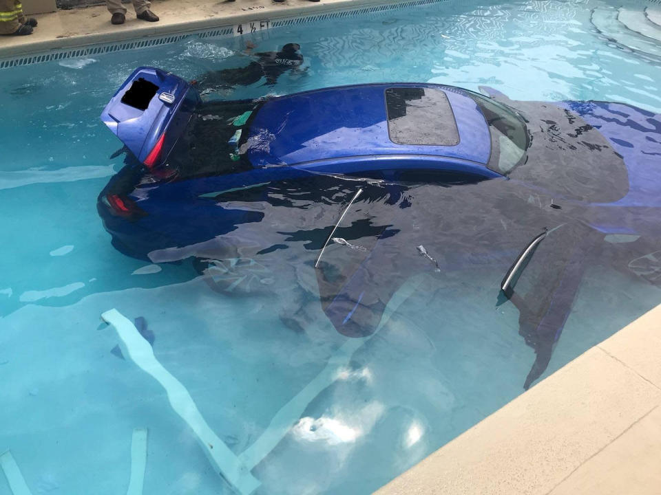<em>Carpool – the car ended up rolling into the pool when a woman thought she had put it into park but hadn’t (Pictures: SWNS)</em>