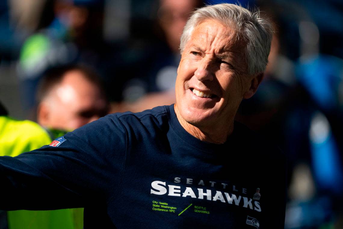 Seattle Seahawks head coach Pete Carroll waves at fans as he walks onto the field prior to the start of an NFL game against the Arizona Cardinals on Sunday, Oct. 16, 2022, at Lumen Field in Seattle.