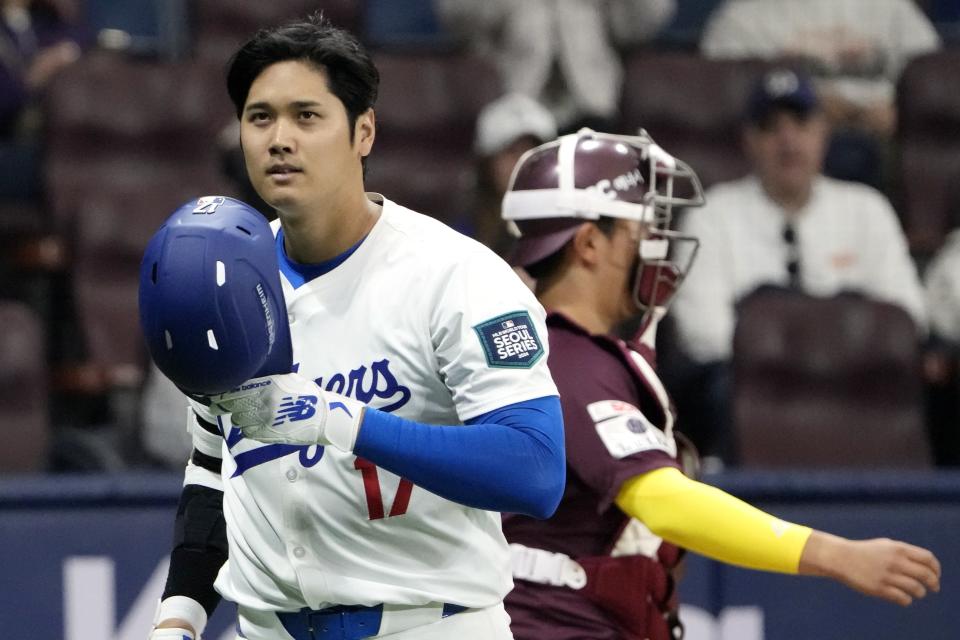 Los Angeles Dodgers' designated hitter Shohei Ohtani returns his bench after he was struck out during the second inning of the exhibition game between the Los Angeles Dodgers and Kiwoom Heroes at the Gocheok Sky Dome in Seoul, South Korea, Sunday, March 17, 2024. The Los Angeles Dodgers and the San Diego Padres will meet in a two-game series on March 20th-21st in Seoul for the MLB World Tour Seoul Series. (AP Photo/Ahn Young-Joon)