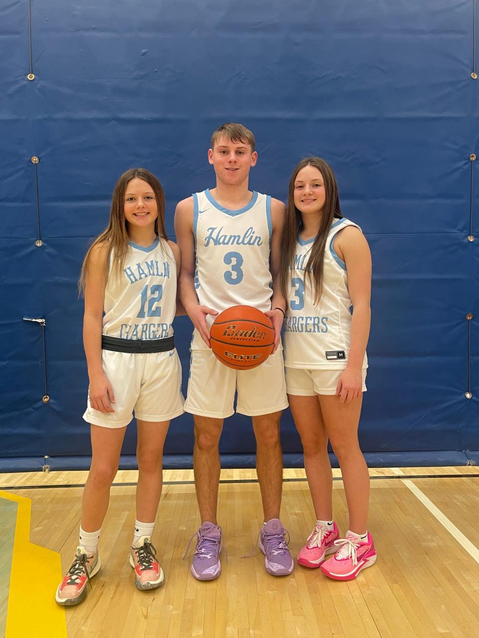 The Neuendorf siblings, from left, seventh-grader Paxton, junior Easton and sophomore Addison, are each making their mark on the basketball court for Hamlin High School's boys and girls basketball teams.