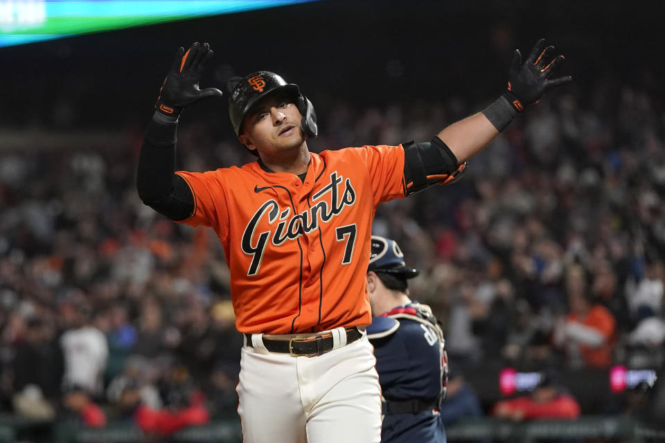 San Francisco Giants' Donovan Solano reacts after hitting a home run against the Atlanta Braves during the ninth inning of a baseball game in San Francisco, Friday, Sept. 17, 2021. (AP Photo/Jeff Chiu)