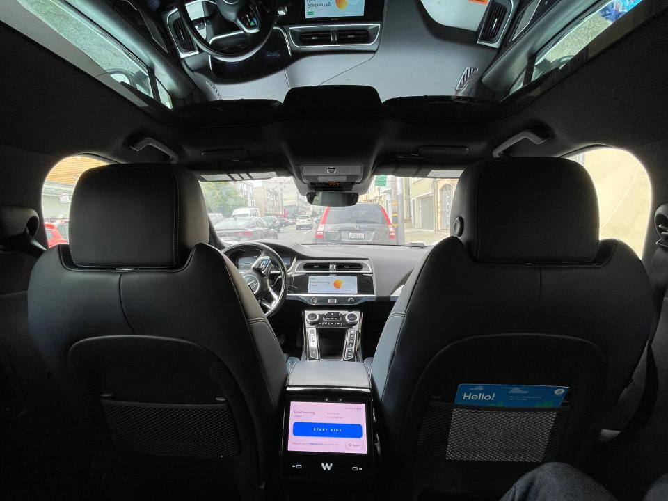 The interior of Waymo's robotaxi with black leather seating.