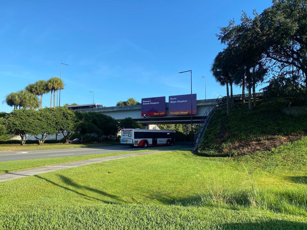 Purple street signs at Disney World in August 2021.