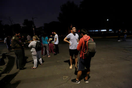 People gather on a street after an earthquake hit Mexico City, Mexico late September 7, 2017. REUTERS/Claudia Daut