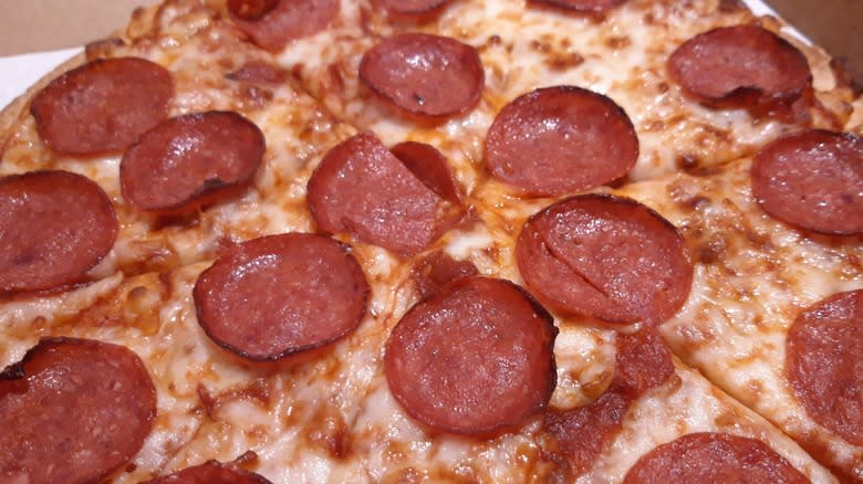 Sliced up pepperoni pizza