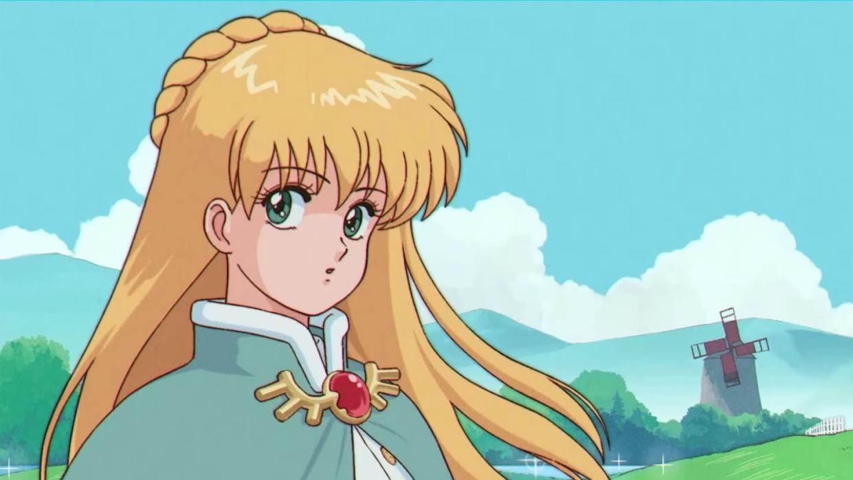 Fields of Mistria animated trailer - a blonde girl in anime style wearing a cloak looks to the camera surprised in front of an idyllic meadow and mountain landscape. 
