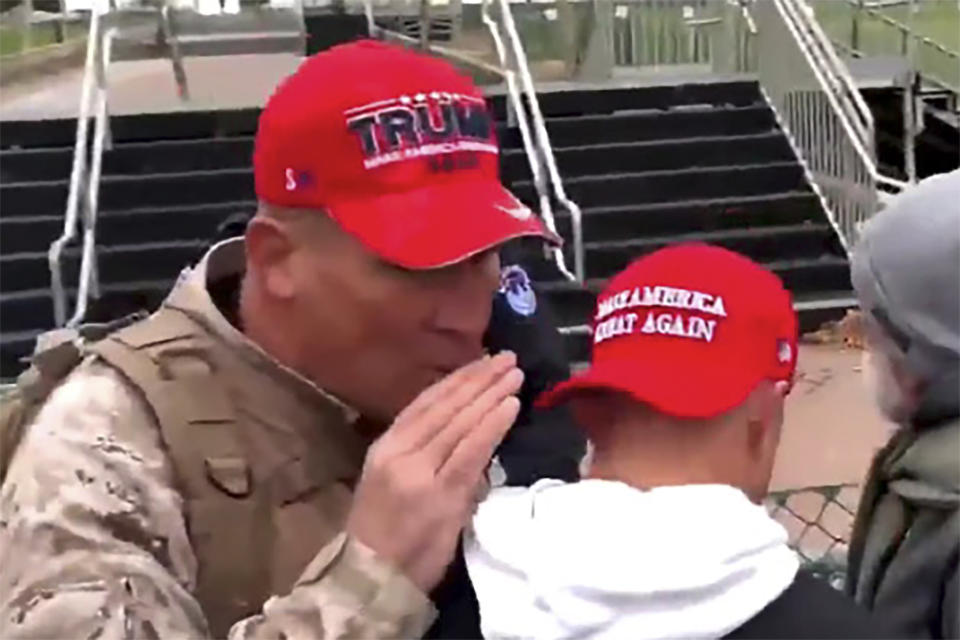 This image from video provided by the Justice Department and contained in the government's sentencing memorandum, shows Ray Epps, left, at the U.S. Capitol, Jan. 6, 2021 in Washington. Epps, a former Arizona resident who was targeted by right-wing conspiracy theories about the U.S. Capitol riot, was sentenced on Tuesday to a year of probation for joining the Jan. 6, 2021 attack by a mob of fellow Donald Trump supporters. (Justice Department via AP)