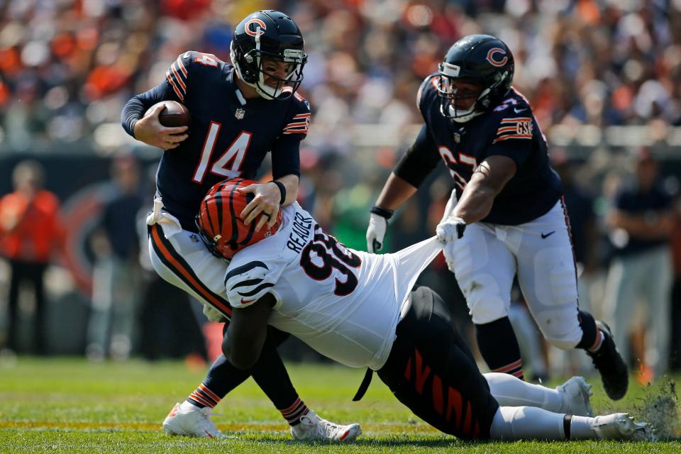 Cincinnati Bengals defensive end D.J. Reader (98) sacks Chicago Bears quarterback Andy Dalton (14) in the second quarter Sept. 19, 2021.