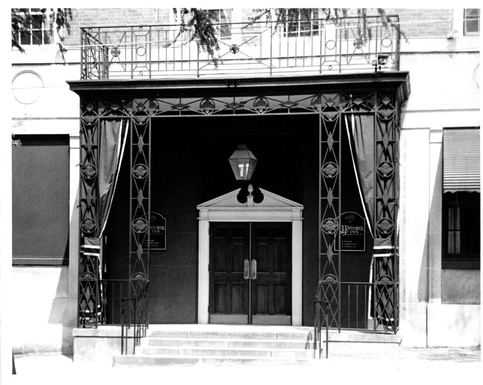 Bruce Cork purchased the hotel about 1978 and renamed it the R. J. Pitcher Inn. The name is shown on either side of the front/south door in this photo.