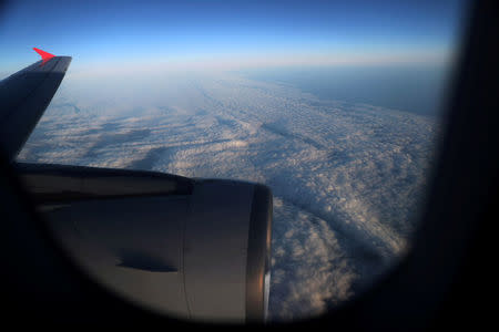 Clouds are seen from an airplane as it flies over the Falkland Islands, May 20, 2018. REUTERS/Marcos Brindicci