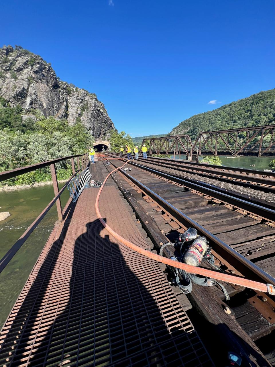 Firefighters from at least three counties responded Monday, June 24, 2024, to a fire in the middle of a trestle railroad bridge over the Potomac River, connecting Washington County to West Virginia.