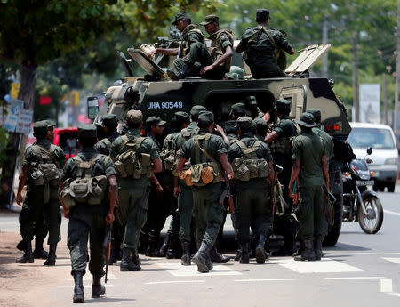 Sri Lankan soldiers patrol a road of Hettipola after a mob attack in a mosque in the nearby village of Kottampitiya, Sri Lanka May 14, 2019. REUTERS/Dinuka Liyanawatte