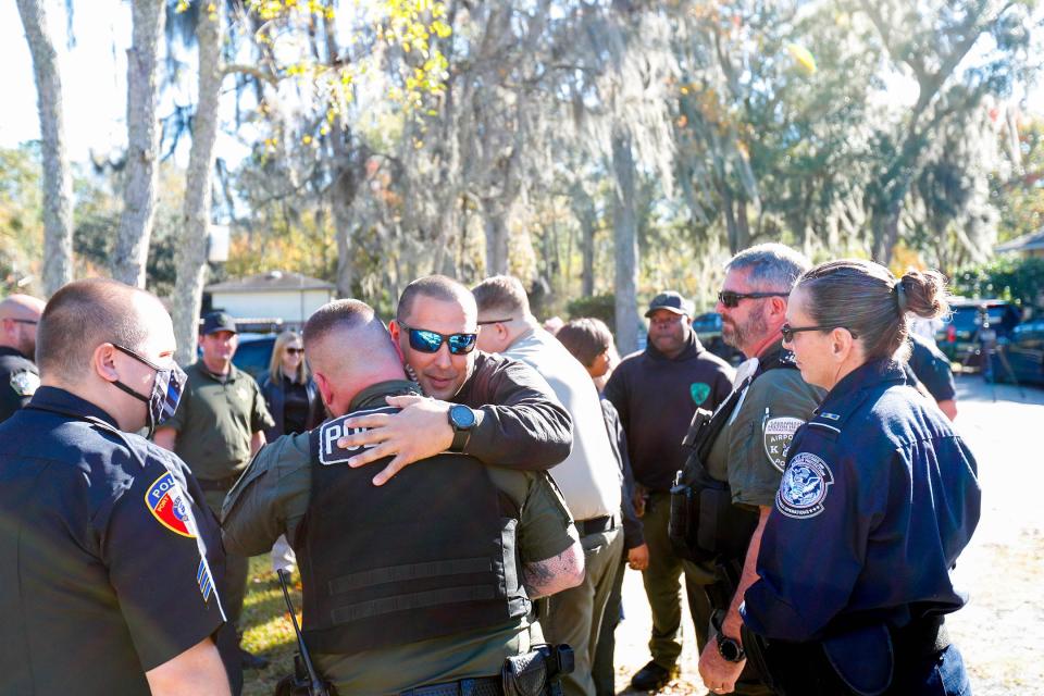 Officers from across the Coastal Georgia area offer their condolences and support to Chatham County Sheriff's Office Sgt. Javier Valdes during an End of Watch ceremony for his partner of three years, K-9 Mac, on Nov. 29, 2022, at Savannah Pet Cemetery, 7 Salt Creek Road.