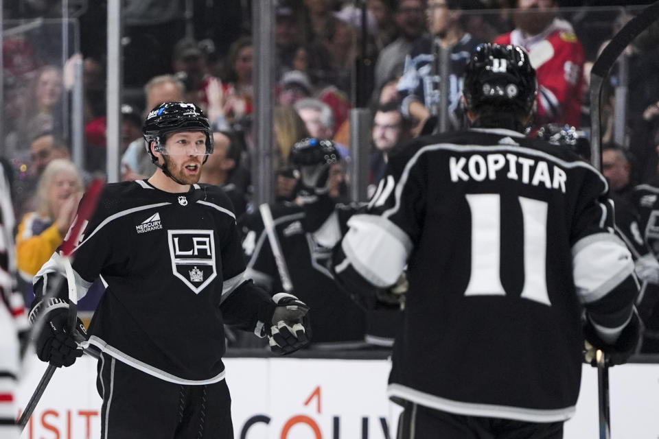 Los Angeles Kings defenseman Vladislav Gavrikov, left, celebrates his goal against the Chicago Blackhawks with center Anze Kopitar during the second period of an NHL hockey game Tuesday, March 19, 2024, in Los Angeles. (AP Photo/Ryan Sun)