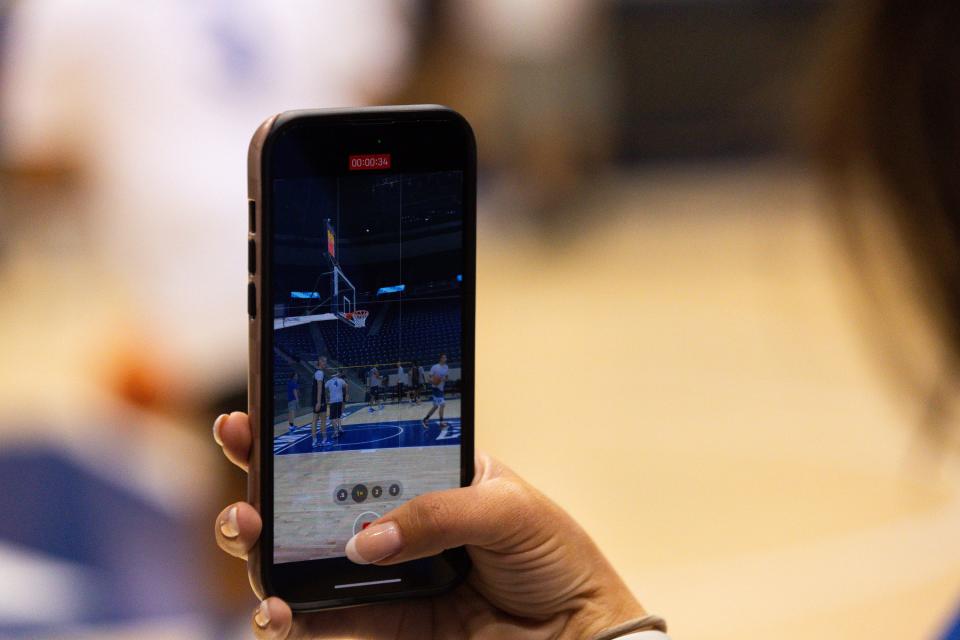 Videos are taken of members of the media running drills with BYU basketball players and coaching staff at Media Madness, an event hosted by the BYU men’s basketball program, at the Marriott Center in Provo on Monday, Oct. 9, 2023. | Megan Nielsen, Deseret News