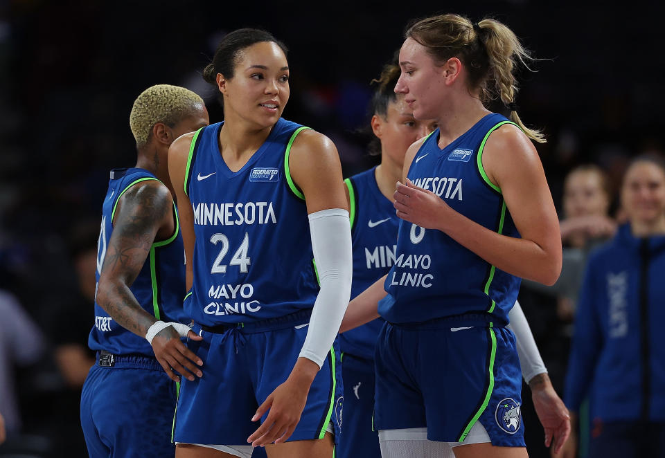 COLLEGE PARK, GEORGIA - SEPTEMBER 10:  Napheesa Collier #24, Courtney Williams #10 and Alanna Smith #8 of the Minnesota Lynx react after their 76-64 win over the Atlanta Dream at Gateway Center Arena on September 10, 2024 in College Park, Georgia.  NOTE TO USER: User expressly acknowledges and agrees that, by downloading and or using this photograph, User is consenting to the terms and conditions of the Getty Images License Agreement.  (Photo by Kevin C. Cox/Getty Images)