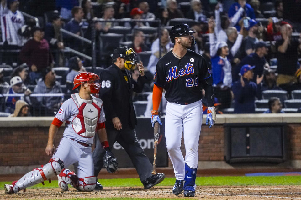 New York Mets' Pete Alonso, right, watches his three-run home run during the seventh inning of a baseball game against the Cincinnati Reds, Friday, Sept. 15, 2023, in New York. (AP Photo/Bebeto Matthews)