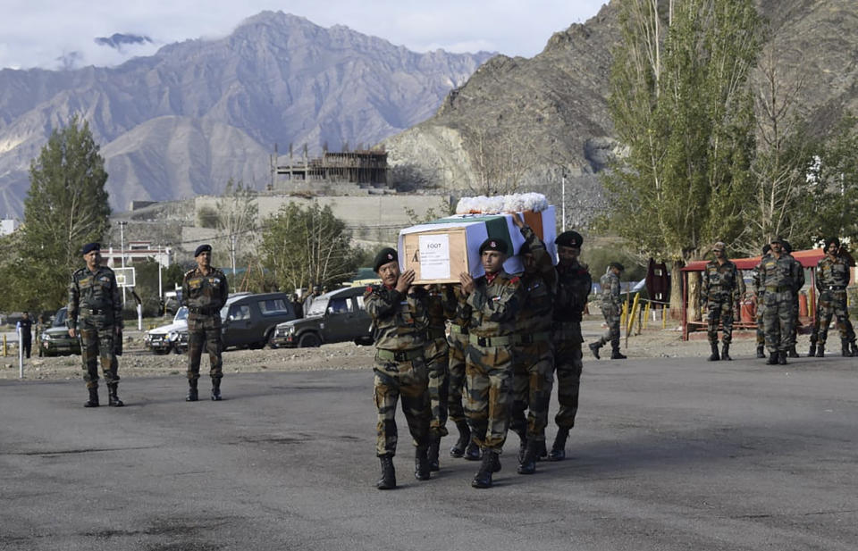 In this photo provided by the Indian Army, soldiers carry the remains of Chandra Shekhar, an Indian army soldier found more than 38 years after he went missing, in Leh, India, Wednesday, Aug. 17, 2022. The soldier and 17 other colleagues were occupying a ridge on Siachen Glacier, high in the Karakoram range in disputed Kashmir's Ladakh region, in May 1984 when they were hit by an avalanche, officials said. (Indian Army via AP)