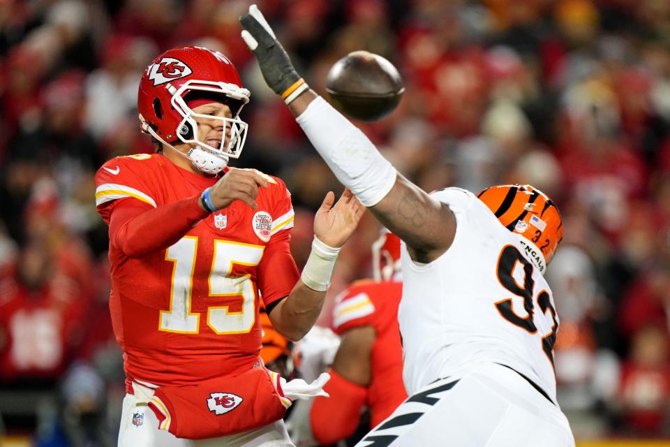 Kansas City Chiefs quarterback Patrick Mahomes (15) throws under presser by Cincinnati Bengals defensive tackle BJ Hill (92) in the third quarter during a Week 17 NFL football game between the Cincinnati Bengals and the Kansas City Chiefs, Sunday, Dec. 31, 2023, at GEHA Field at Arrowhead Stadium in Kansas City, Mo. The Kansas City Chiefs won, 25-17.