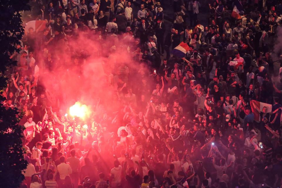 <p>People celebrate France’s victory on the Champs Elysees in Paris on July 10, 2018, after the final whistle of the Russia 2018 World Cup semi-final football match between France and Belgium. (Photo by Zakaria ABDELKAFI / AFP) </p>