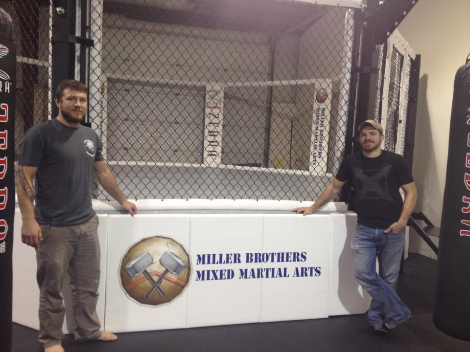 Dan and Jim Miller show the fighting ring at Miller Brothers MMA in Sparta, which they constructed themselves.