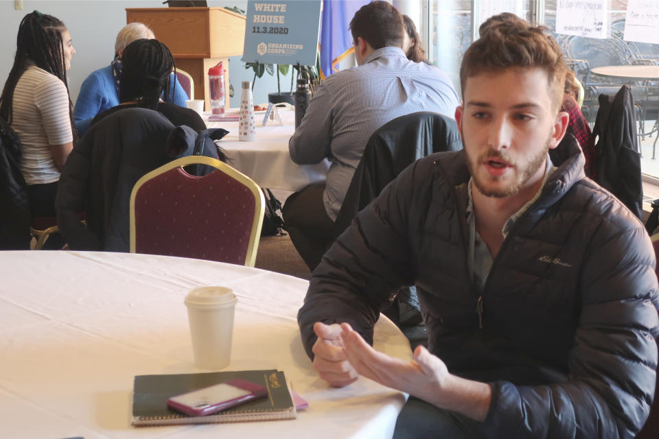 University of Wisconsin student David Pelikan, 21, talks about why organizing students like him to work for the eventual Democratic presidential nominee is crucial to defeating President Donald Trump in battleground states like Wisconsin, Thursday, Jan. 16, 2019, during a training session in Madison, Wis. (AP Photo/Scott Bauer)