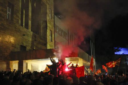 Demonstrators stormed into Macedonia's parliament in Skopje. Macedonia April 27, 2017. REUTERS/Ognen Teofilovski