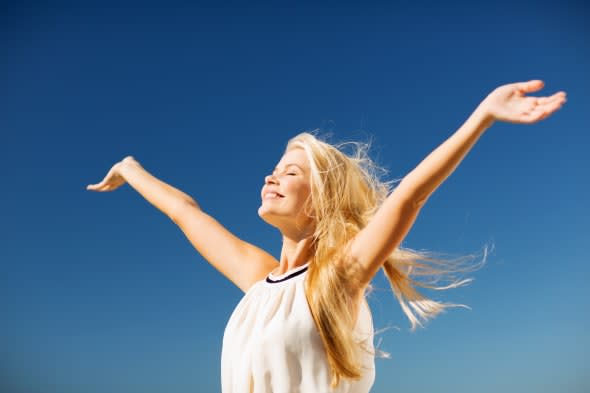 lifestyle concept - beautiful happy woman enjoying summer outdoors