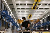 A worker is seen at the Strata Manufacturing facility, in Al Ain