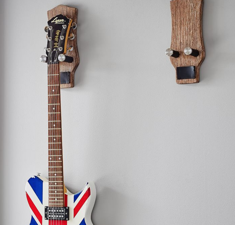 <p>PB Teen</p><p><strong>$39.00</strong></p><p>Rock on! Turn their instrument into a work of art with this wall mount that will securely display their guitar. Depending on how many they have, you can also buy these in sets of two.</p>