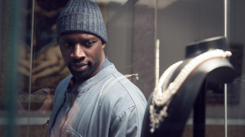 Omar Sy (as the character Luis Perenna) eyes the Queen's Necklace in the Netflix series 