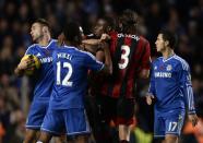 West Bromwich Albion's Jonas Olsson (2nd R) and Chelsea's Branislav Ivanovich (L) clash during their English Premier League soccer match at Stamford Bridge in London November 9, 2013.