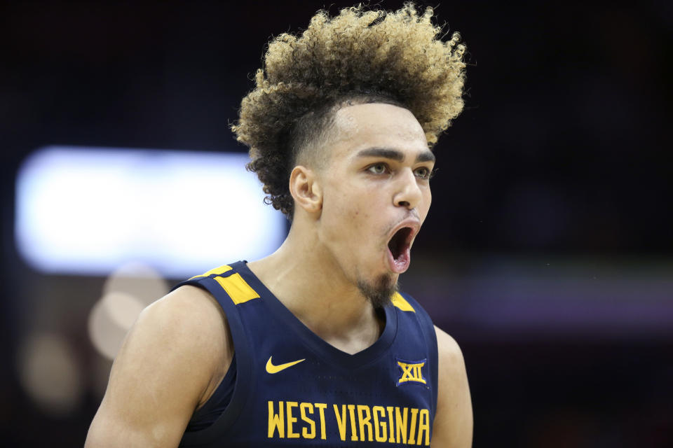 West Virginia's Emmitt Matthews Jr. celebrates during the second half of an NCAA college basketball game against Ohio State Sunday, Dec. 29, 2019, in Cleveland. West Virginia defeated Ohio State 67-59. (AP Photo/Ron Schwane)