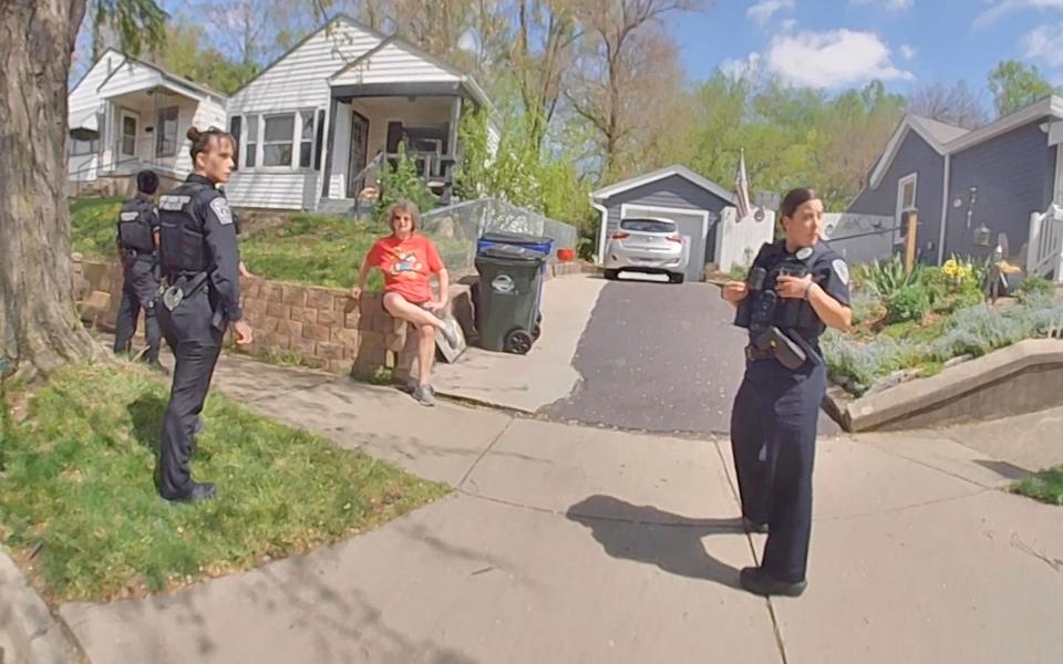 Ann Mayers is accosted by police outside her home