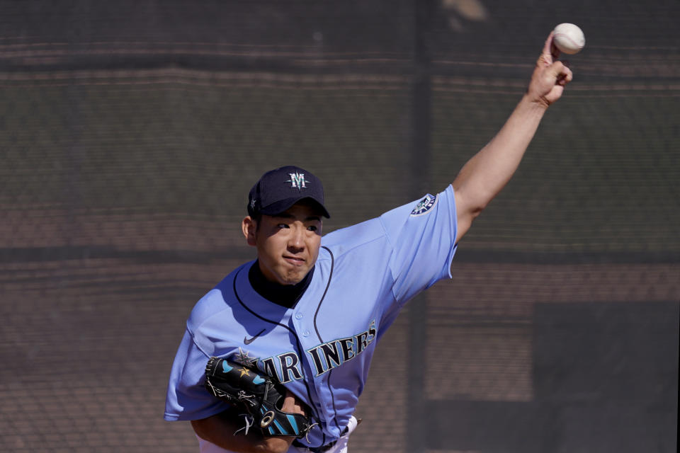 Seattle Mariners pitcher Yusei Kikuchi throws during baseball spring training Thursday, Feb. 25, 2021, in Peoria, Ariz. (AP Photo/Charlie Riedel)