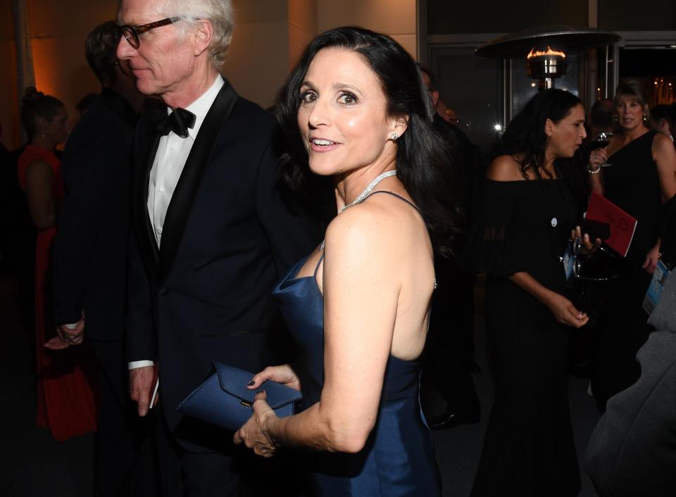 Julia Louis-Dreyfus and her husband, Brad Hall, arrive at the Governor's Ball. 