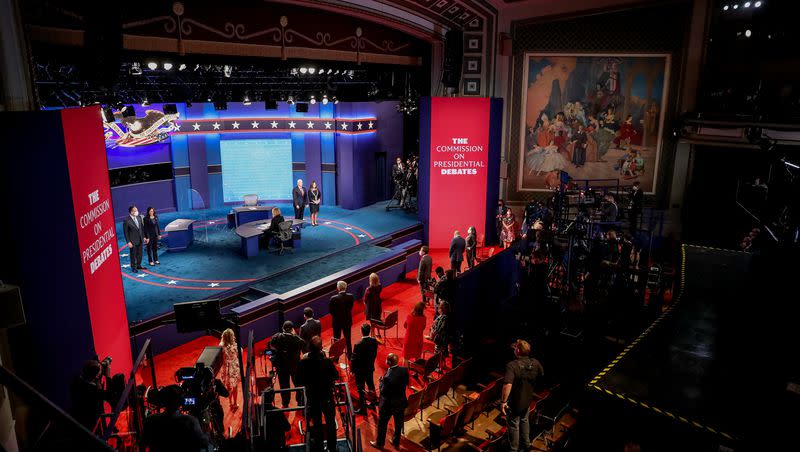 Democratic vice presidential candidate Sen. Kamala Harris, D-Calif., is greeted by her husband, Douglas Emhoff, while Vice President Mike Pence is greeted by his wife, Karen, at the end of the vice presidential debate, moderated by Susan Page, at Kingsbury Hall at the University of Utah in Salt Lake City on Oct. 7, 2020.