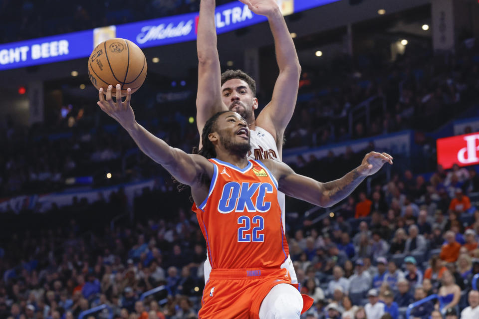 Nov 8, 2023; Oklahoma City, Oklahoma, USA; Oklahoma City Thunder guard Cason Wallace (22) shoots in front of Cleveland Cavaliers forward <a class="link " href="https://sports.yahoo.com/nba/players/5681" data-i13n="sec:content-canvas;subsec:anchor_text;elm:context_link" data-ylk="slk:Georges Niang;sec:content-canvas;subsec:anchor_text;elm:context_link;itc:0">Georges Niang</a> (20) during the second half at Paycom Center. Oklahoma City won 128-120. Mandatory Credit: Alonzo Adams-USA TODAY Sports