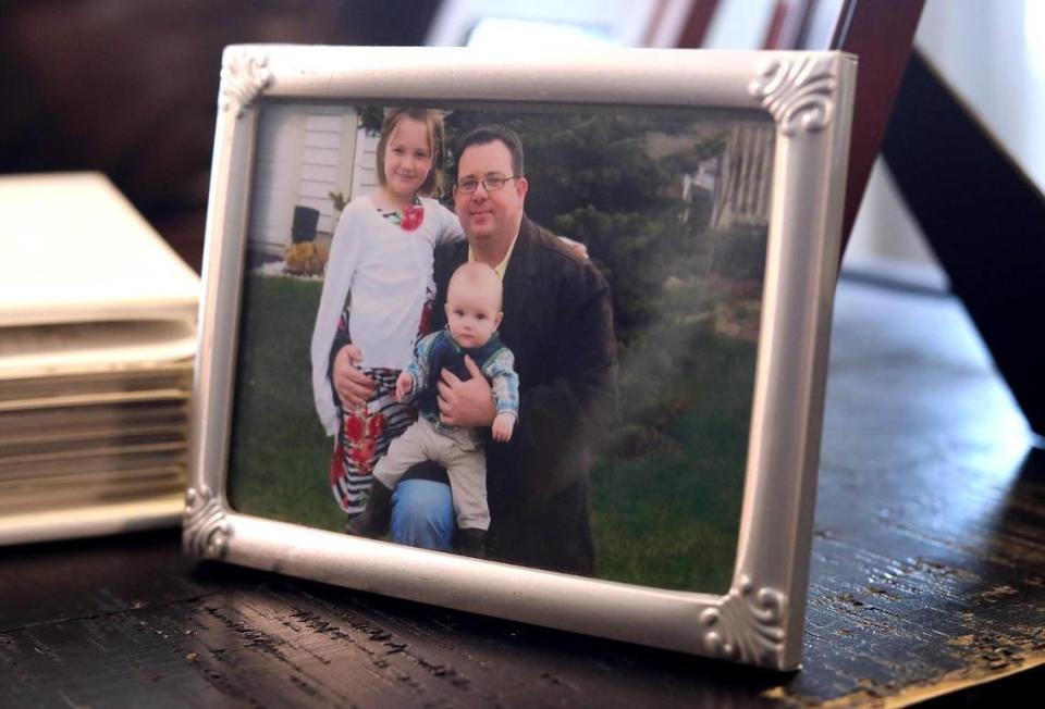 A photograph shows Aaron Watson with his two children, Cameron and Westen.